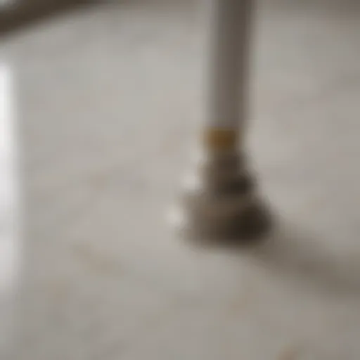 An antique white grout caulk tube on a marble countertop