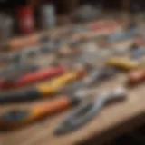 A variety of caulking tools arranged on a workbench, showcasing different designs and materials.