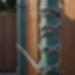 A close-up of a chain link fence post with a fresh coat of paint
