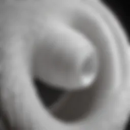 Flexible white duct coiled in intricate pattern
