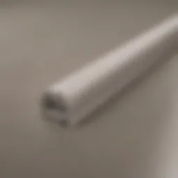 Close-up view of rolled vinyl baseboard showcasing texture and finish