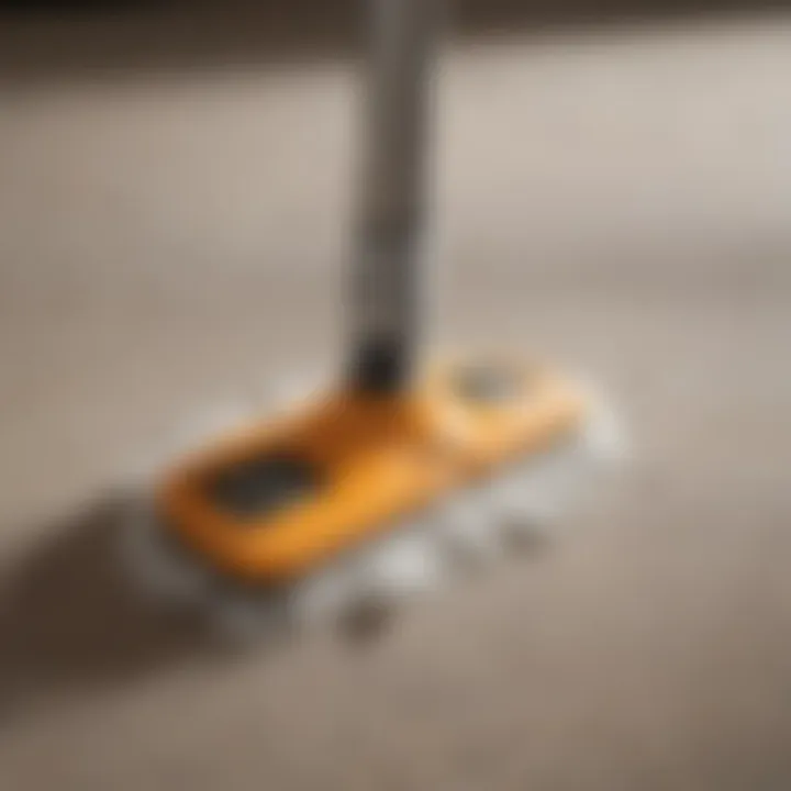 Detailed View of Spray Mop Nozzle Close-up of a spray mop nozzle with microfiber pad attached