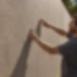 Artisan applying DAP stucco repair mixture on wall