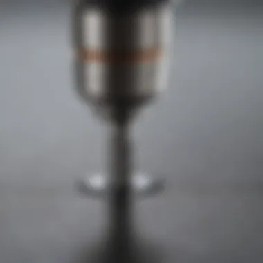 Close-up view of a Dremel bit in action on a stainless steel surface, highlighting precision and tool effectiveness.