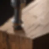 Close-up of a broken screw embedded in wood