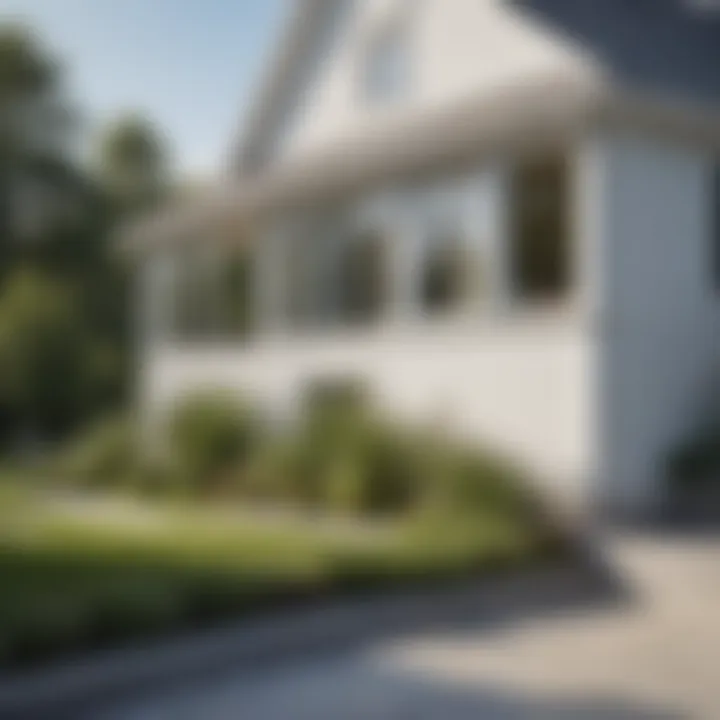 Landscaped garden with white vinyl siding house in the background