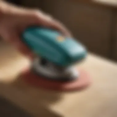 Ergonomic Excellence in Palm Sander Design Close-up of ergonomic grip on palm sander