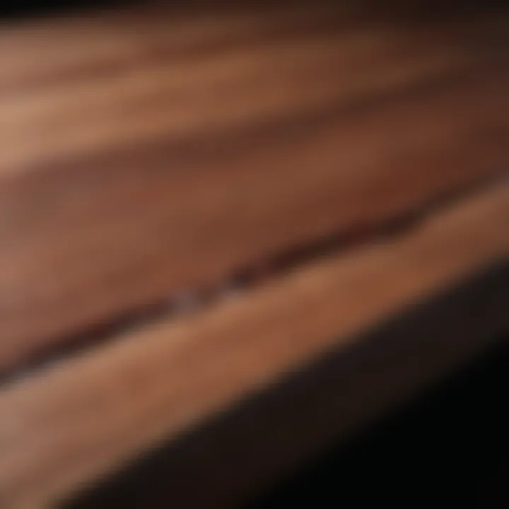 Close-up of wood glue bonding two pieces of mahogany