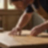 Woodworker applying glue on oak boards