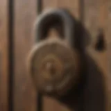 A close-up view of a vintage padlock resting on an antique wooden surface, showcasing its intricate design.