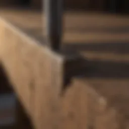 Robust tie nail being hammered into wooden beam