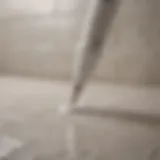 Close-up of white grout pen in action on tile