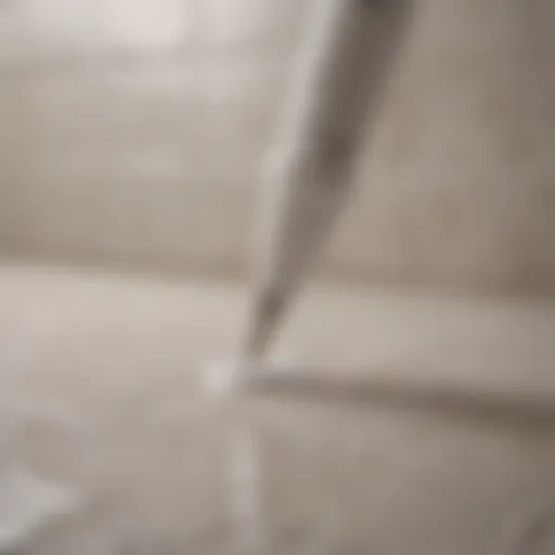 Close-up of white grout pen in action on tile