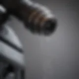 Close-up of an electric power washer nozzle demonstrating pressure control