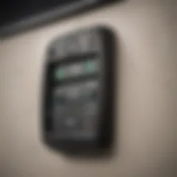 Close-up view of a modern garage door opener fob highlighting its buttons and design.