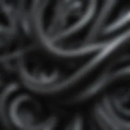 Abstract swirls of dark grey spray paint