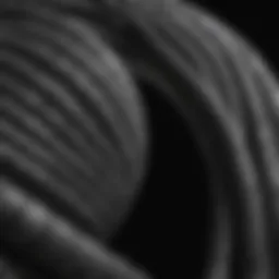 A close-up view of a short coiled water hose demonstrating its unique design.