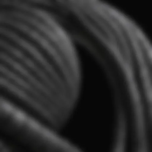 A close-up view of a short coiled water hose demonstrating its unique design.