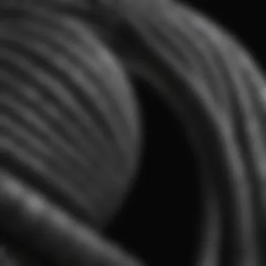 Close-Up of Short Coiled Water Hose Design A close-up view of a short coiled water hose demonstrating its unique design.