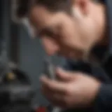 Mechanic inspecting Briggs & Stratton 140cc spark plug