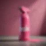 Pink spray paint can against artistic background