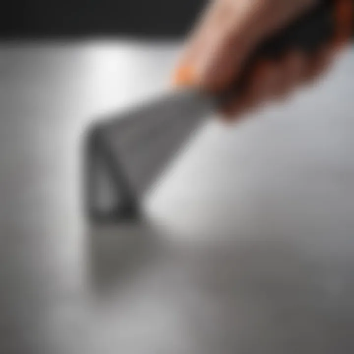 Close-up of a precision caulking tool, highlighting its unique feature set and ergonomic design.