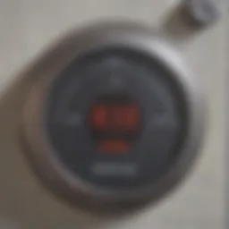 Detailed view of a Reliance water heater thermostat