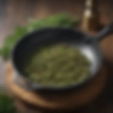 Cast iron skillet being seasoned with aromatic herbs