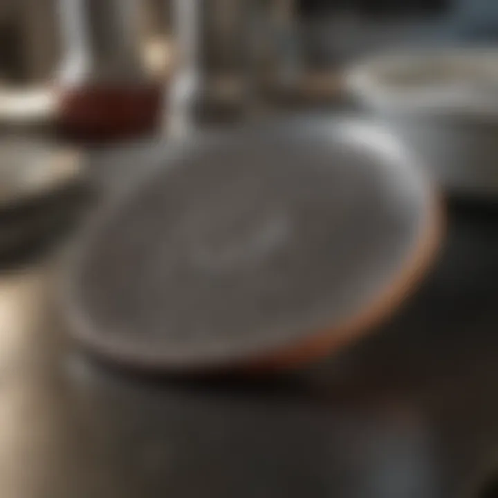 Steel scrubber in action on greasy dishes
