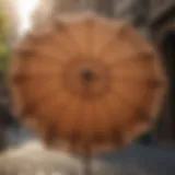 Elegant tan market umbrella with intricate design