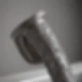 Close-up view of a tub spout pipe showcasing its intricate design