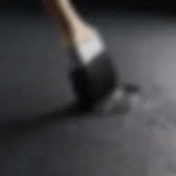 Black asphalt paint can with paintbrush