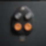 Close-up of a dual garage door opener remote control showcasing buttons and features.