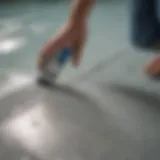 Close-up of a vinyl pool liner showing a repair kit being applied