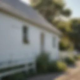 White barn with Valspar paint under clear sky