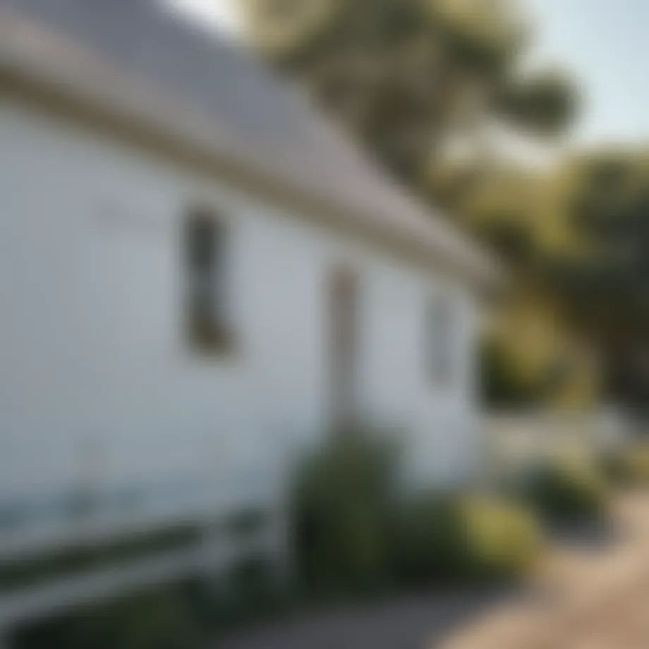 White barn with Valspar paint under clear sky